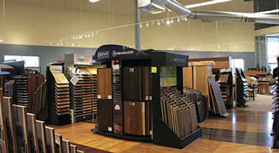 Ambassador Floor is a two-story building with an open floor plan. The employees work on the second floor, which overlooks the showroom on the first floor.