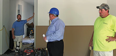 Ambassador Floor employees on the job site tell Hart there were a lot of shorts in the wood flooring product they're installing.