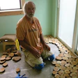 Tony Lutz went through 48 tubes of adhesive to install a juniper cordwood floor in his family's home.