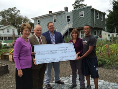 (L-R) Carolyn Campbell Brown, Mannington Family Council Chair; Keith Campbell, Mannington Mills Chairman of the Board, Tom Smith, Mannington Family Council member; Beth Davenport, Director of Lighthouse Ministry and Olive Street Community Garden coordinator; Isaac Moore, Olive Street Community Garden manager.