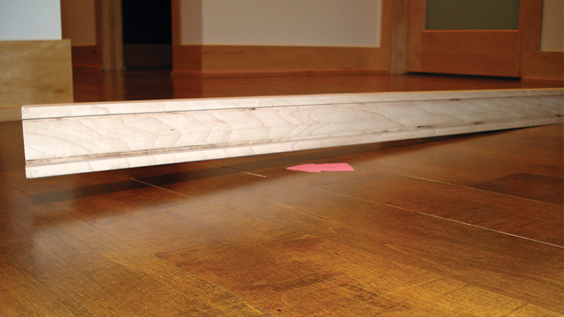 A compelling reason to check for flatness before starting: At this old home, the exterior walls had settled, creating this drastic slope in the wood floor. (All photos courtesy of Roy Reichow)