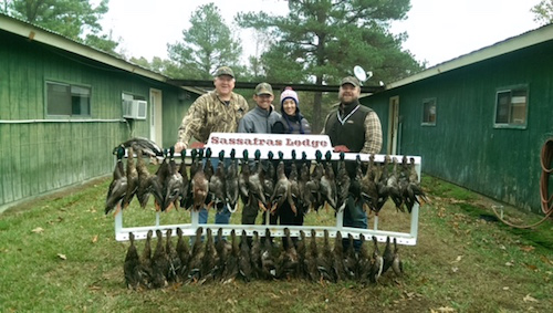 Tommy Maxwell; my husband, Joe; me and Wil Maxwell at the lodge.