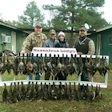Tommy Maxwell; my husband, Joe; me and Wil Maxwell at the lodge.