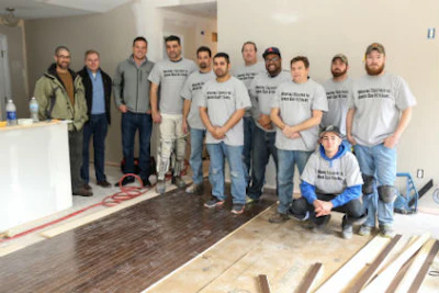 NWFA VP of Education & Certification Brett Miller, NWFA President & CEO Michael Martin, Lockwood General Manager Brian Wood and volunteer installers from All Wood Floor Company, JD’s Flooring, Jerry’s Fine Floors, Just Around the Corner, and JW Hardwood Floors at Army veteran Chris Sanna’s home.