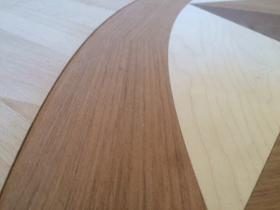 The medallion is shy of the floor here during dry-fitting to allow for adhesive thickness.