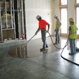 These contractors are using a grout pump to spread the self-leveler.