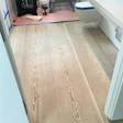 A cupping 18-inch-wide Doug fir wood floor.