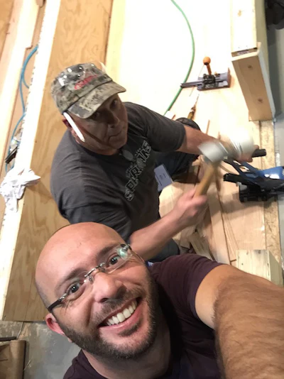 NWFA Intermediate Installation students Mark Williams (holding the mallet) and Santiago Cosentino.