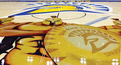 Larger-than-life metallic Spartans on the new San Jose State University basketball floor created an out-of-the-box challenge for United Services Inc. (Courtesy San Jose State University)