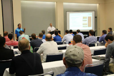 Sam Biondo and Cris Biershank lead a seminar on the science of adhesives.