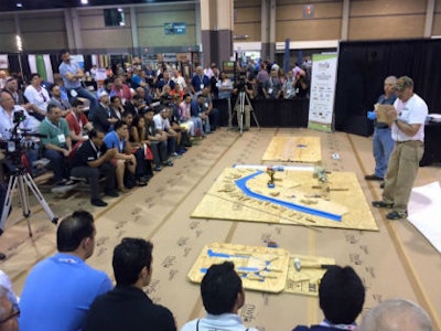 John Alford and Sprigg Lynn talk wood bending at the NWFA Expo Tech Zone.