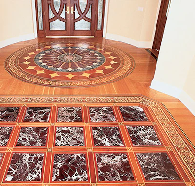 Hand-cut inlays and Italian marble combine in this renovation. - Click to enlarge