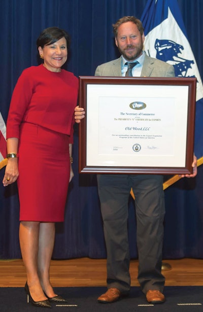 David Old holds the President's 'E' Award for Export next to U.S. Secretary of Commerce Penny Pritzker in Washington D.C.