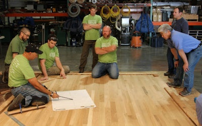 Lenny Hall, left, demostrates how to use a trammel.