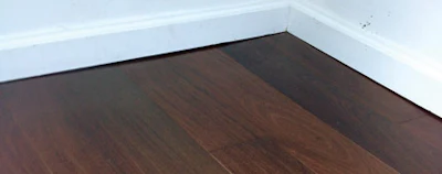 Baseboards not flush to the floor are an obvious indication of bad subfloor prep.