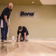 Todd Schutte, Bona director of professional product development, and Bobby Mohr, technical services & training specialist, demonstrate sealer application.
