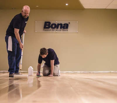 Todd Schutte, Bona director of professional product development, and Bobby Mohr, technical services & training specialist, demonstrate sealer application.