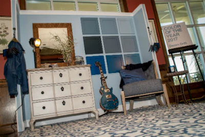 A vignette displays the various shades of AkzoNobel's Color of the Year 'Denim Drift.'