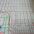 A roughed-in basement floor showing radiant tubes before the poured-in cement. Places where many tubes converge (oftentimes at doorways) can create hot spots in the floor. (Photo courtesy of Radiant Professionals Alliance)