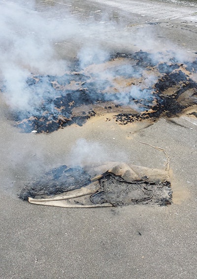 Spontaneous combustion in the wood flooring industry most commonly comes from two causes: stain rags or (shown here) bags of wood floor dust. (Photo courtesy of Josh Hansman)