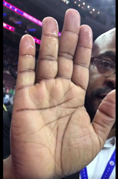 Philly.com's Steve Pompay shows how much moisture was on the Philadelphia 76ers basketball court. (Twitter)
