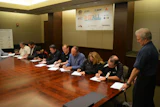 Representatives from nine underlayment/substrate manufacturers sign the MOU.