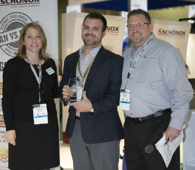 Carrie Wells (left) of Schönox presents first place in the Worst Subfloor Contest to A.J. Robert (center) of CDC Distributors on behalf of Carpets Direct, along with Doug Young (right) of Schönox.