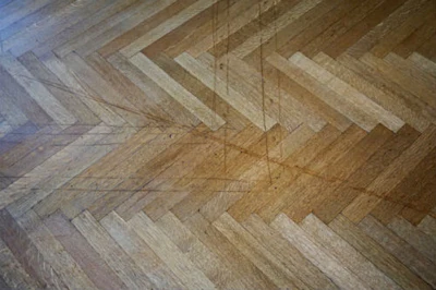 Cut marks from fitting carpet pads in office cubicles when an old historic house was used for offices.
