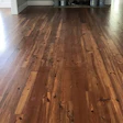 Pine floors are part of our everyday business. This is a reclaimed heart pine floor common to our area. It is a first- and second-grade mix that we supplied, installed, sanded flat and finished with a satin oil-modified polyurethane.