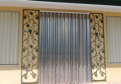 Accordion shutters were drawn across the company's showroom windows in preparation for the hurricane.