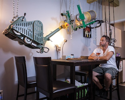 Zoltan Boros hoisted his wood flooring machines up toward the dining room ceiling in case his house flooded.