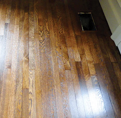 The floors in the master bedroom of a $2 million remodeling project after being sanded, stained and finished.