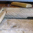 A 0.025-inch gap existed between the flooring and the OSB subfloor, but the fastener and schedule used were acceptable.