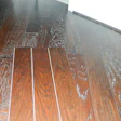 White dust from cutting drywall and other construction materials can become lodged in the texture that is common on the surface of many of today's prefinished floors, creating complaints.
