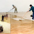 In this photo, a crew from Albany, N.Y.-based J.J. Curran & Son Inc. uses lambswool applicators to apply the original formulation of Trophy Gym Finish by Hillyard, which was an epoxy-based gym finish, at Niskayuna High School. 'We used to apply it using multiple guys using lambswool,' says Seamus Curran, project manager and chief estimator for J.J. Curran. Their current technique can be seen in the photo below. 'Nowadays we apply finish on gyms using Hillyard's Multi-Flo, which pumps out finish using an electronic pump. We went from four or more guys applying to one guy on the machine and one guy cutting in at the walls. We're still using a lot of oil-based finish, but now it's all 350 VOC.'