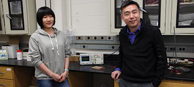 Wang (right) and Research Assistant Chunhua Yao in their laboratory at the University of Wisconsin.