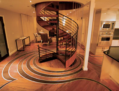 Advances in technology have made free-form designs like this 2010 Wood Floor of the Year winner by Archetypal Imagery Corp. more accessible than they were when designs were hand-graphed. Created by Distinctive Hardwood Floors, each piece of the wenge ribbon in this floor was engraved with its own number since no two pieces were the same.