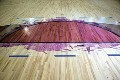 Sports specialists have a wider range of options available for adding color to finish because they can tape off areas where they don’t want color and pull straight onto them, eliminating the need for feathering at turns. On this court multiple thin applications of Bona’s SuperSport Paint and SuperSport DTS Sealer Hybrid Mix resulted in this purple color. (Photos courtesy of Bona US)