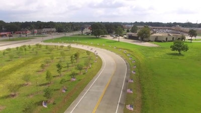 Flags positioned along a right of way in front of Summer's Abbey Flooring Center. Source: KFDM.