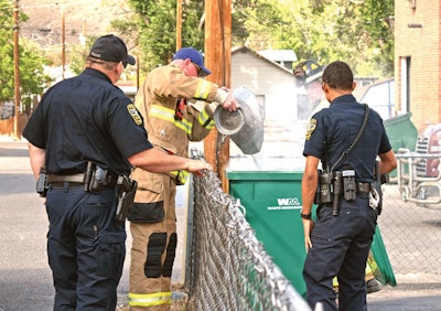 Firefighters put out a fire believed to be caused by spontaneous combustion from wood finish-soaked rags. Source: The Mountain Mail