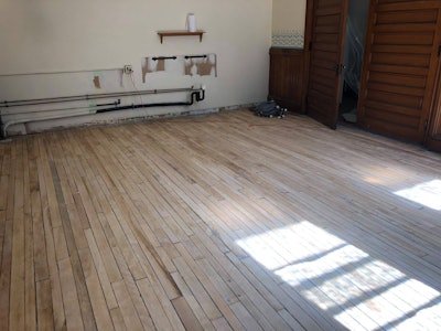 A 128-year-old maple wood floor was discovered beneath vinyl flooring in a former Grand Army of the Republic Hall, built in 1889. Photos courtesy of the New England Civil War Museum.