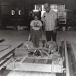 That's me with my grandpa running his G&G Mini Sander invention for bowling lanes; it was a 42-inch-wide belt sander that followed sanding by his G&G Maxi Sander and prepped the lane for finish coats.