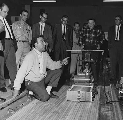 Here my grandfather is at a seminar demonstrating a prototype he was working on for lane sanding (that machine never gained traction like the other two did).