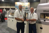Todd Spillman (left) and Kirk Spillman of Eagle Machinery recieve the Challengers Distinguished Achievement Award at IWF.