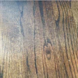 Sanding marks from a hand-held random orbital sander were obvious on this wood floor once stain was applied.