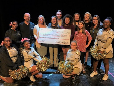 Thomas Jefferson High School students and Bona US representatives present a check for $21,000 to St. Jude Children's Research Hospital.