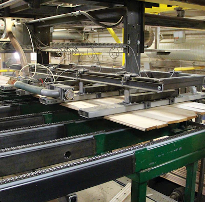 (6) A robotic vacuum lifts sheets of side-matched boards.