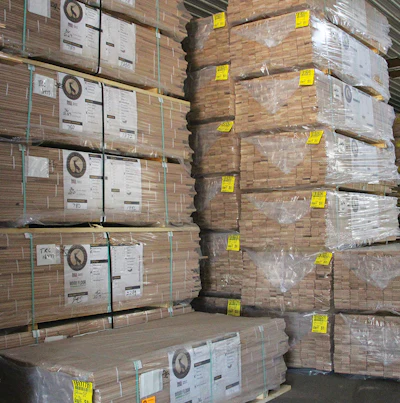 (11) Stacks of flooring are placed in the finished products warehouse, ready to be shipped.