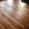 On this engineered heart pine floor, we filled all the knot holes with Woodwise Ebony filler. Photo courtesy of Specialty Flooring.