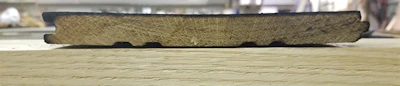 If you don't heat the surface fast enough and get enough water on the flooring right away, you'll end up with cupped shou sugi ban boards like this one.